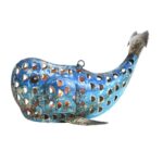 Handcrafted recycled iron whale tealight lantern with intricate perforated design and vibrant blue weatherproof finish